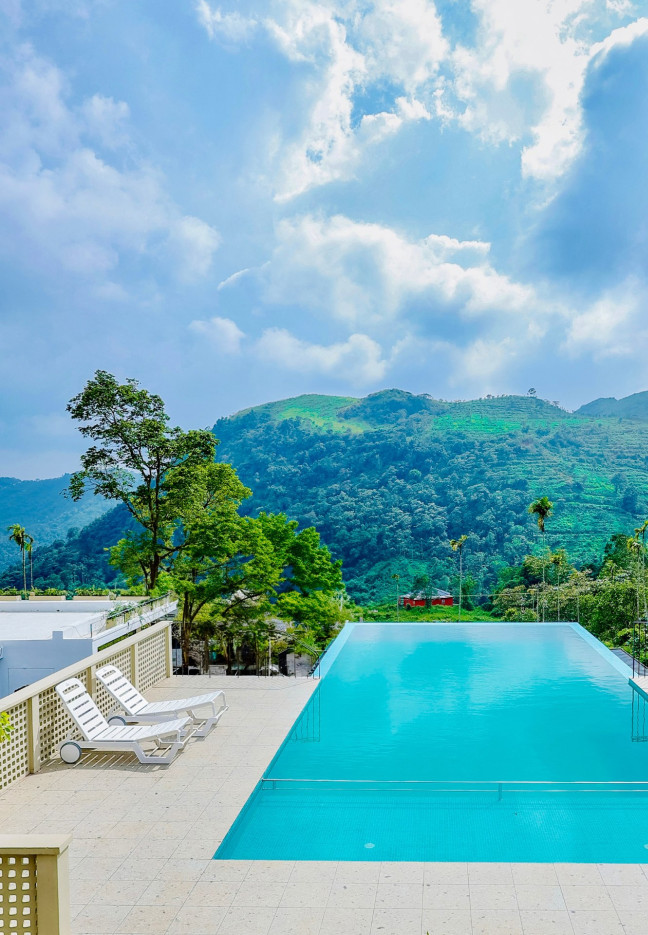 A collage of various luxury resorts in Kakkadampoyil, showcasing diverse architectural styles and scenic views.